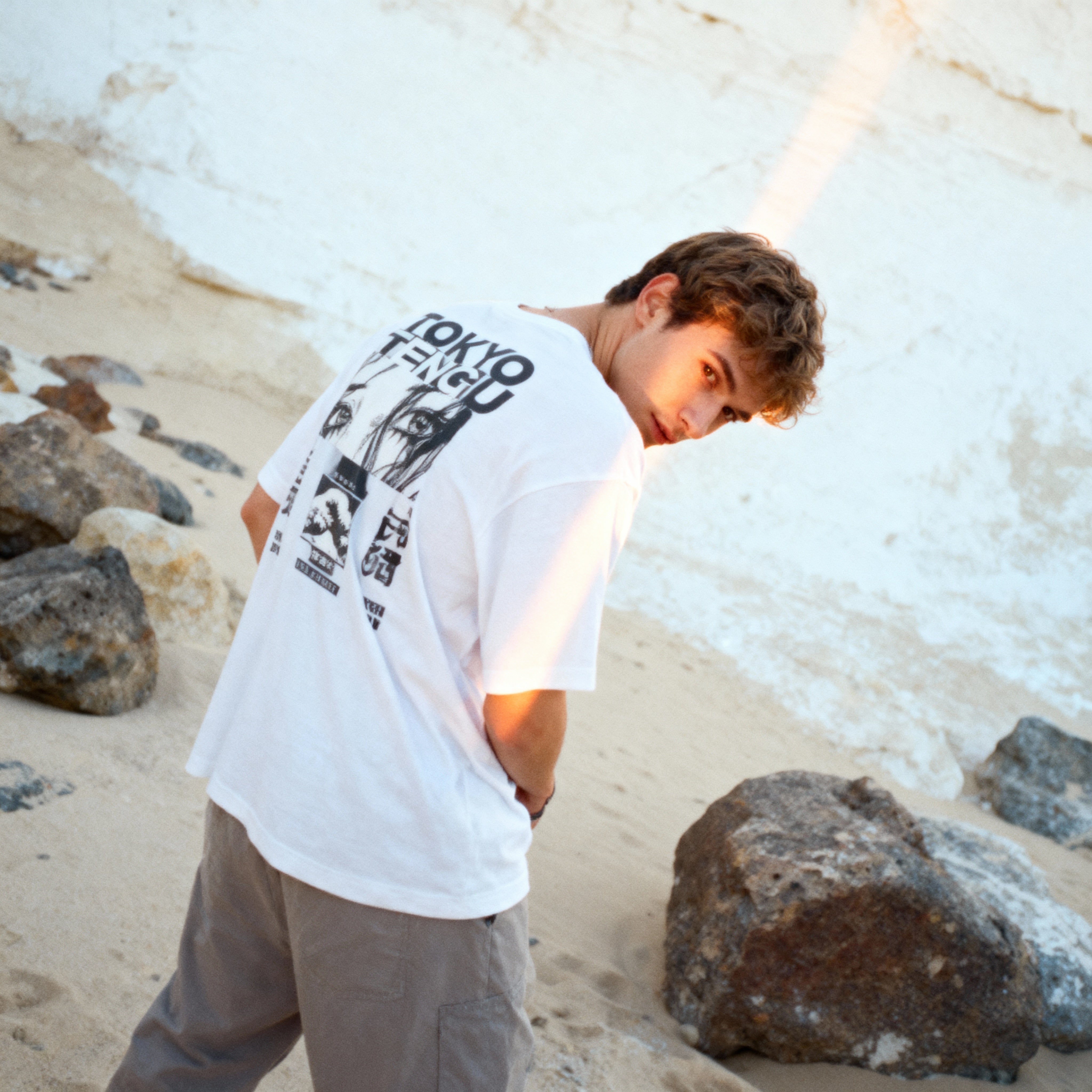 white_man_wearing_Silent_Drift_-_Black_CNvuewYM5e1kwdYXgzVo_back_pose_looking_down_into_camera_low_angle_1