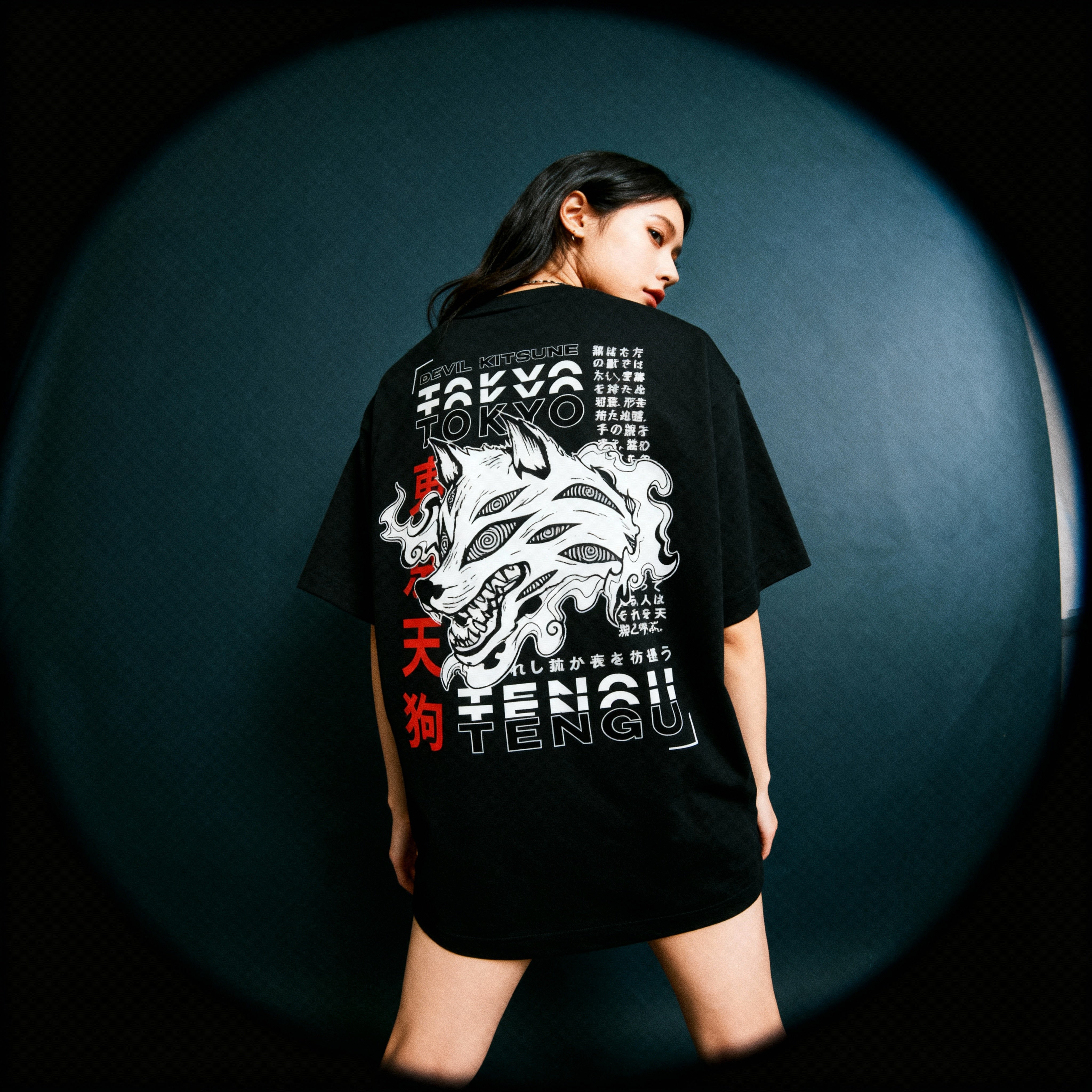 woman_wearing_Devil_Pact_-_Black_back_pose_lookin_at_us_dark_background_low_angle_fish_eye